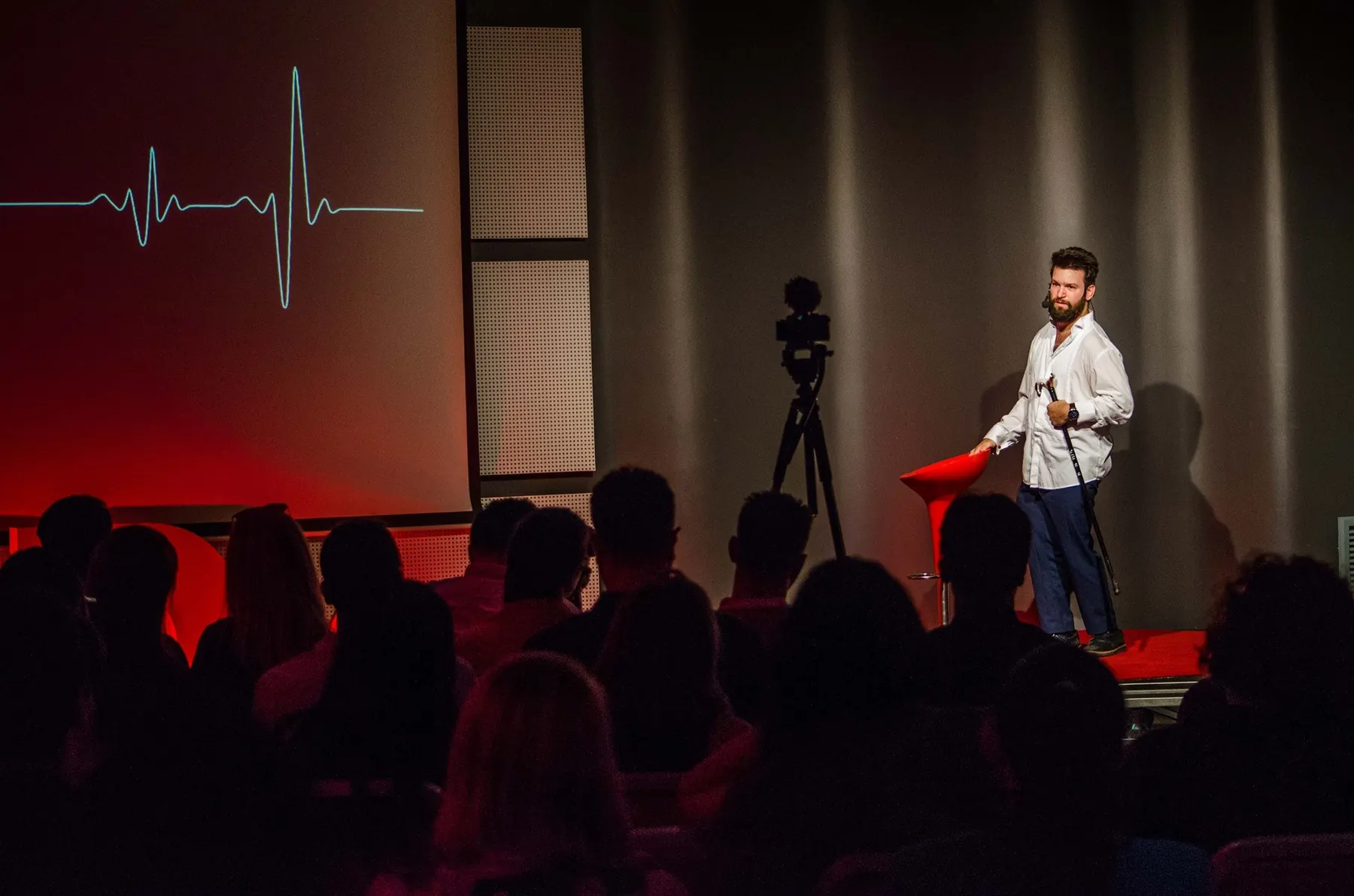 Tedy Necula speaking on stage